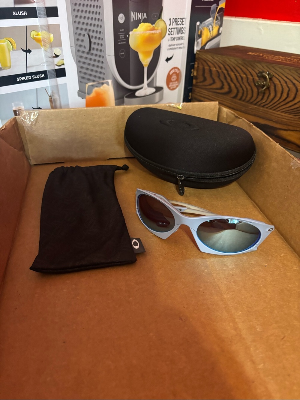 Oakley Light Blue PLANTARIS Sunglasses with Mirrored Lenses